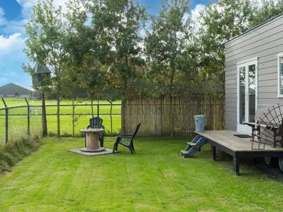 a backyard with a picnic table and a bench at Holiday home in Burgerbrug near the beach in Burgerbrug