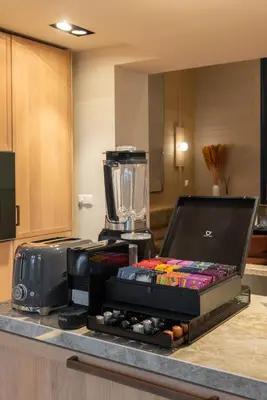 a kitchen counter with a blender on top of it at Newly renovated luxurious 200 SQM loft in city centre in Amsterdam