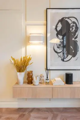 a wooden shelf with a picture on top of it at Newly renovated luxurious 200 SQM loft in city centre in Amsterdam