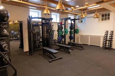 a gym with lots of equipment in a room at Hotel Spaander BW Signature Collection in Volendam
