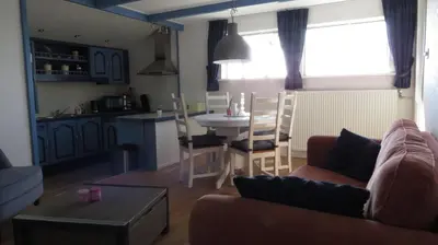 a living room with a couch and a table at gouwzicht in Amsterdam
