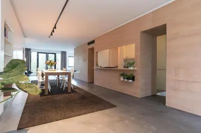 a living room with a table and a dining room at City centre Loft on the historic Canal in Utrecht