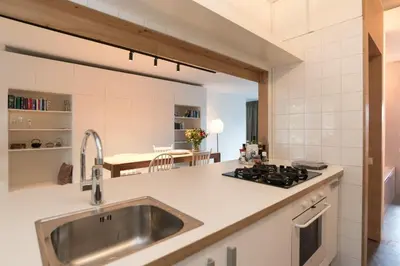 a kitchen with a sink and a stove at City centre Loft on the historic Canal in Utrecht