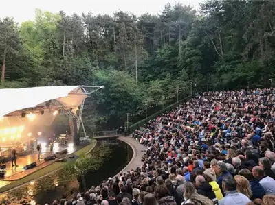 a large crowd of people watching a concert at The West Wing Bloemendaal in Bloemendaal