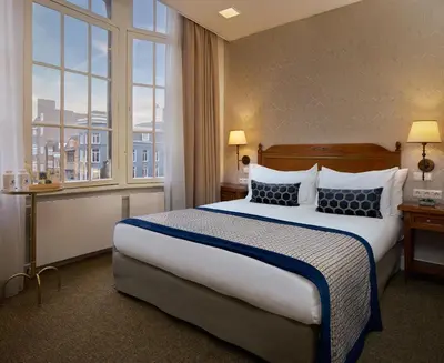 a hotel room with a bed and a window at Dikker & Thijs Hotel in Amsterdam