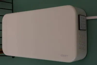 a white appliance is attached to a green wall at Eco lodge Utrecht Leidsche Rijn in Utrecht