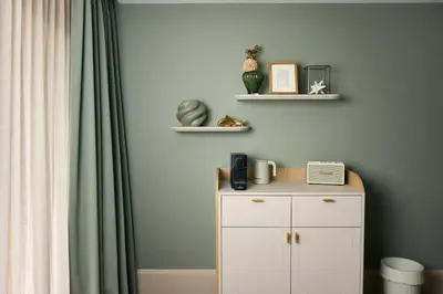 a room with a white cabinet and a green wall at Van der Valk Hotel Volendam - Recently renovated in Volendam