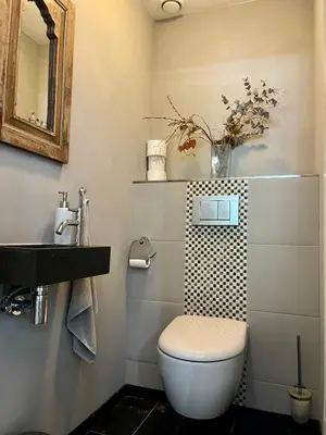 a bathroom with a toilet and a sink at NOVA Houseboat DELUXE Free Bikes in Amsterdam