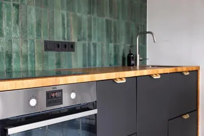 a kitchen with a sink and a counter top at Résidence Beaufort in Zandvoort