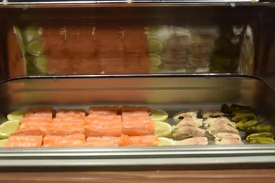a tray of sushi with fish and other foods at Prinsengracht Hotel in Amsterdam