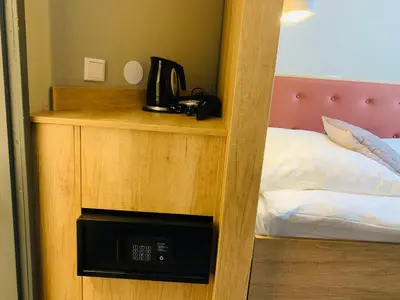 a room with a bed and a phone on a shelf at Prinsengracht Hotel in Amsterdam