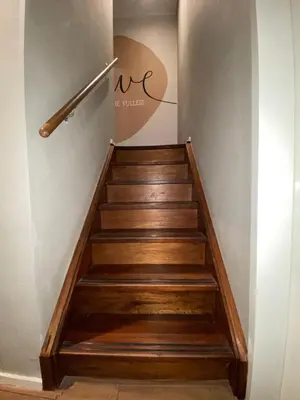 a staircase with wooden steps in a building at Hotel Old Quarter in Amsterdam