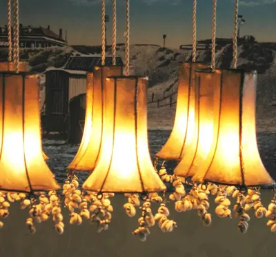 a group of lights that are hanging up at Augusta Hotel in IJmuiden