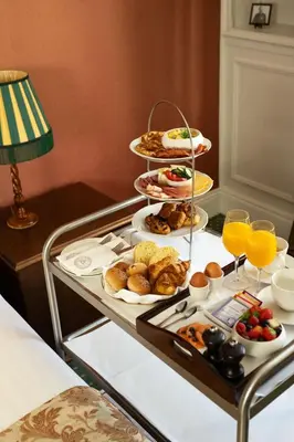 a breakfast tray with food and drinks on a table at Landgoed Duin & Kruidberg in Santpoort-Noord