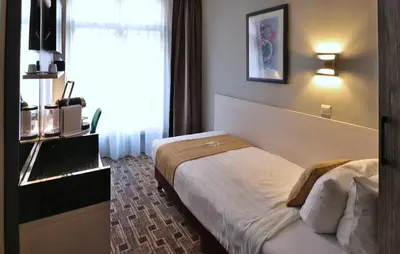 a hotel room with a bed and a window at XO Hotels City Centre in Amsterdam