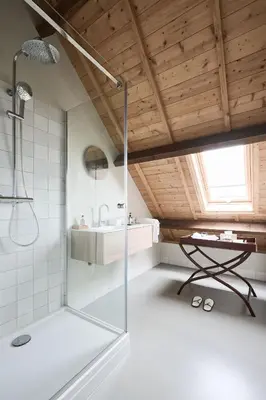 a bathroom with a glass shower and a sink at Landgoed Huis te Jaarsveld in Jaarsveld