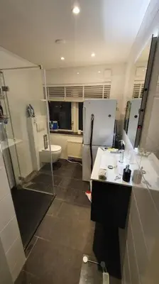 a kitchen with a refrigerator and a sink at Luminous appartment - Juliana Park free parking in Utrecht