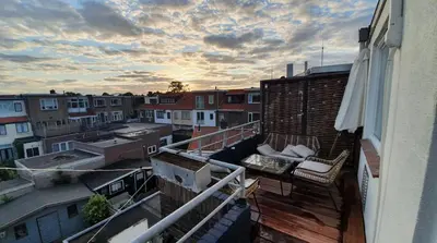 a balcony with a view of a city with buildings at Luminous appartment - Juliana Park free parking in Utrecht