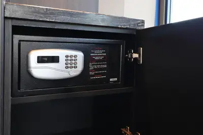 a microwave oven with a white toaster oven inside at XO Hotels Couture in Amsterdam