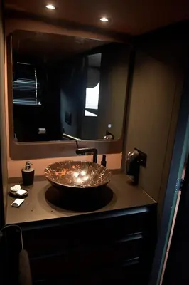 a bathroom with a sink with a mirror at EUPHRATE HOUSeBOAT in Amsterdam