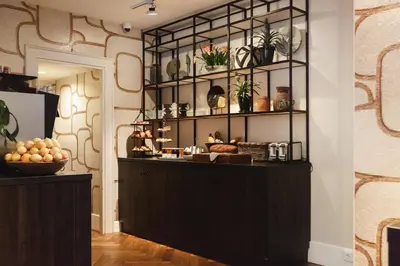 a room with a counter with plants on the wall at The Delphi - Amsterdam Townhouse in Amsterdam