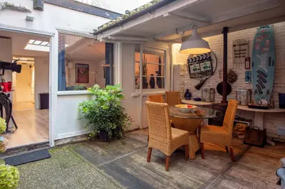 a patio with a table and chairs at Gezellig appartement in de mooie oude binnenstad van Alkmaar in Alkmaar