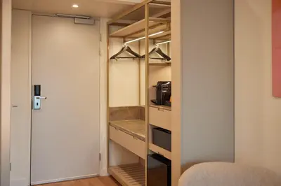 a walk in pantry with a sink and a microwave at WestCord Art Hotel Amsterdam 4 stars in Amsterdam