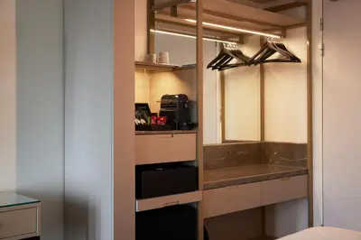 a small kitchen with a sink and a counter at WestCord Art Hotel Amsterdam 4 stars in Amsterdam