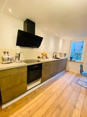 a kitchen with a sink and a counter top at City-beach apartment nearby Amsterdam in Hoorn