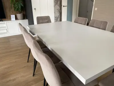a white table and chairs in a room at Katwijk Center, 1 min away from the beach! in Katwijk aan Zee