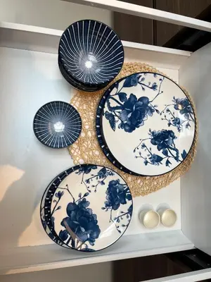 four blue and white plates on a shelf at B&B Urban Oasis with Free Parking in Amsterdam