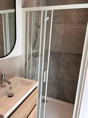a bathroom with a shower and a sink at Amsterdam Beach Apartment 17, incl Parking + Garden in Zandvoort