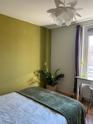 a bedroom with a bed and a ceiling fan at Great House for Two in Amsterdam in Amsterdam