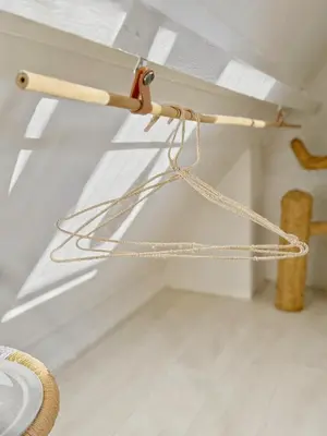 a wooden pole with ropes on a ceiling at ELSK Cottage in Zandvoort