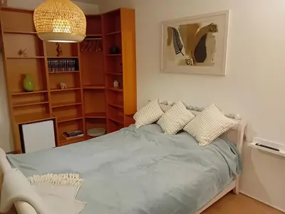 a bedroom with a bed with pillows on it at Oudaen 36 in Lelystad