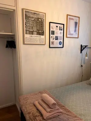 a bedroom with a bed with towels on it at Amsterdam Beach Apartment 50 - Basic, incl parking in Zandvoort