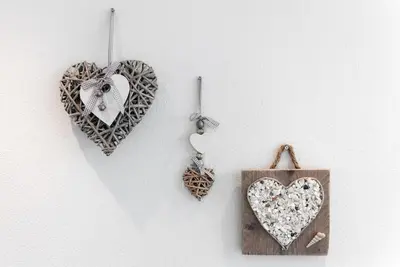 three heart ornaments hanging on a wall at Modern strandhuis 350 m van zee Egmond aan Zee in Egmond aan Zee