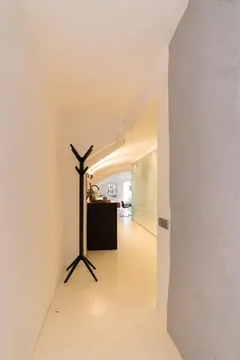 a hallway of a house with a tripod in the middle at Wellness Apartment on the Wharf Utrecht in Utrecht