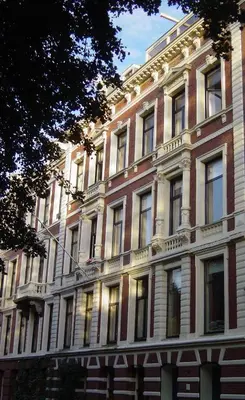 a large brick building with a lot of windows at Park Mansion Hotel in Amsterdam