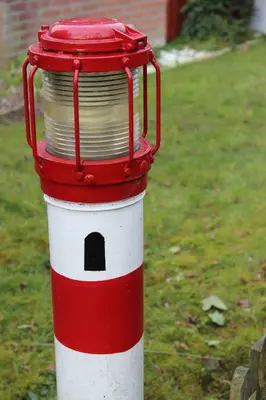 a red and white bird house with a plate on it at Vakantiebungalow in Riviera Maison stijl nabij zee en strand, bos en duin in Warmenhuizen