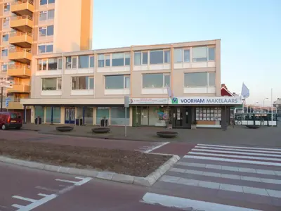 a building with a crosswalk in front of a street at Appartement 