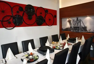 a conference room with a long table with chairs and food at Hotel De Zoete Inval Haarlemmerliede in Haarlem