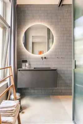 a bathroom with a sink and a mirror at Vondel 99 in Amsterdam