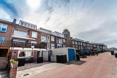 a row of brick buildings on a city street at Appartement en Studio Papillon in Zandvoort