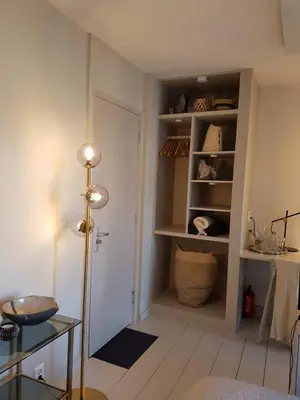 a room with a hallway with a door and shelves at The Superstay Boutique guestroom in Amsterdam