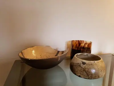 two bowls sitting on a glass table next to a wall at The Superstay Boutique guestroom in Amsterdam