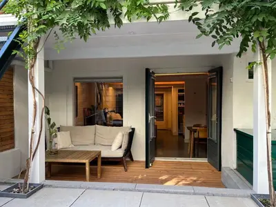 a living room with a couch and a table at This Must Be The Place in Utrecht