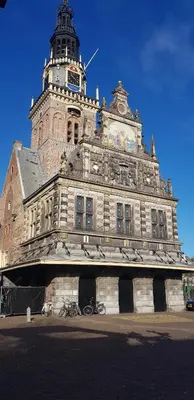a building with a clock tower on top of it at Amrâth Hotel Alkmaar in Alkmaar