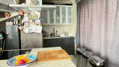 a kitchen with a bowl of fruit on a counter at Two nice rooms in residential area with private bathroom in Almere