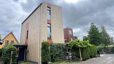 a small building with bikes parked in front of it at Two nice rooms in residential area with private bathroom in Almere